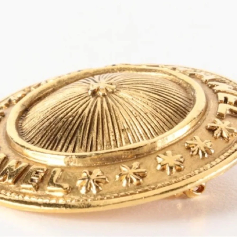 Vintage gold Chanel Brooch.